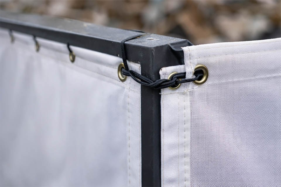 detalle de lona para toldo con refuerzo perimetral y ollados